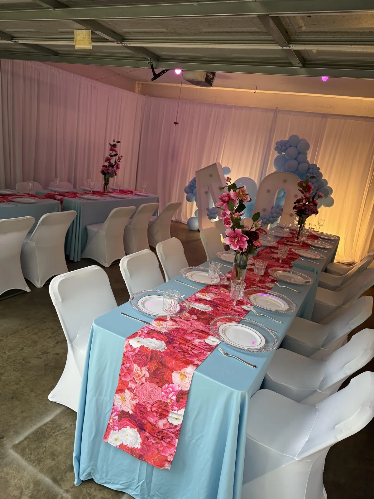Luxury birthday party decor with themed balloon garland and centerpieces by Curated Experiences