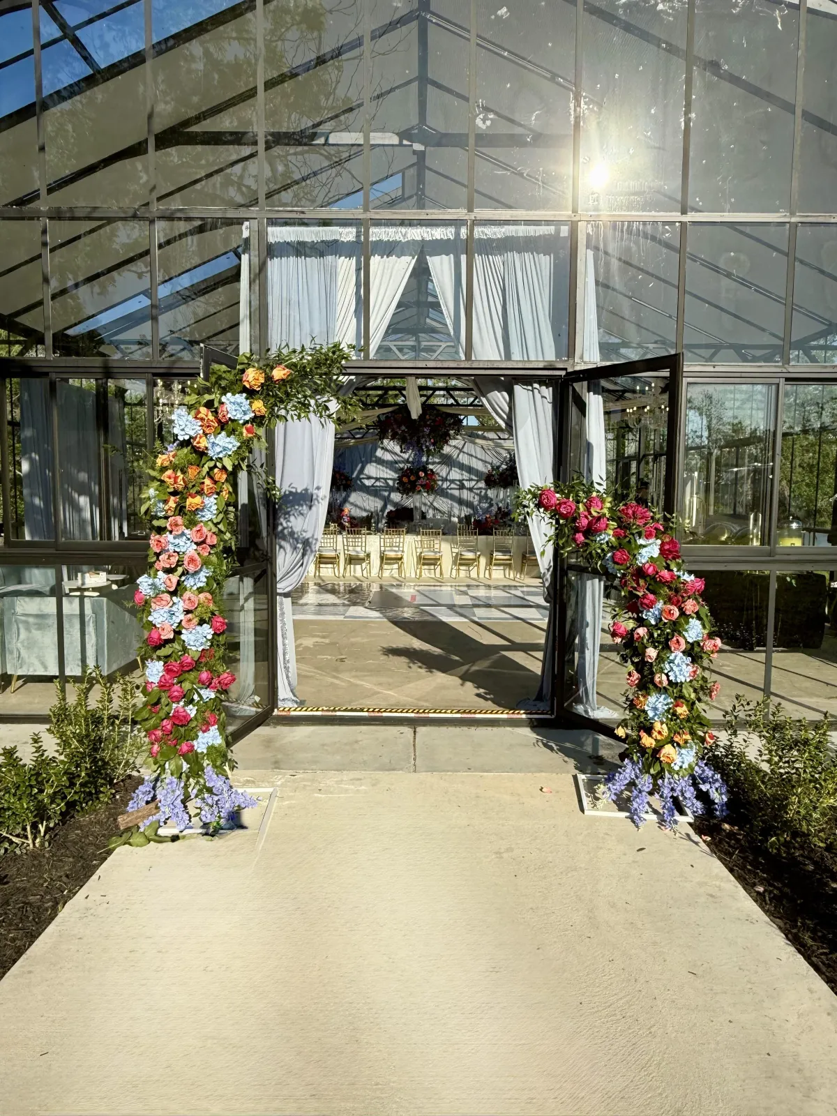 Curated Experiences wedding decor with floral arch horn arrangements, East Texas