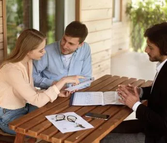 Smiling couple reviewing mortgage options