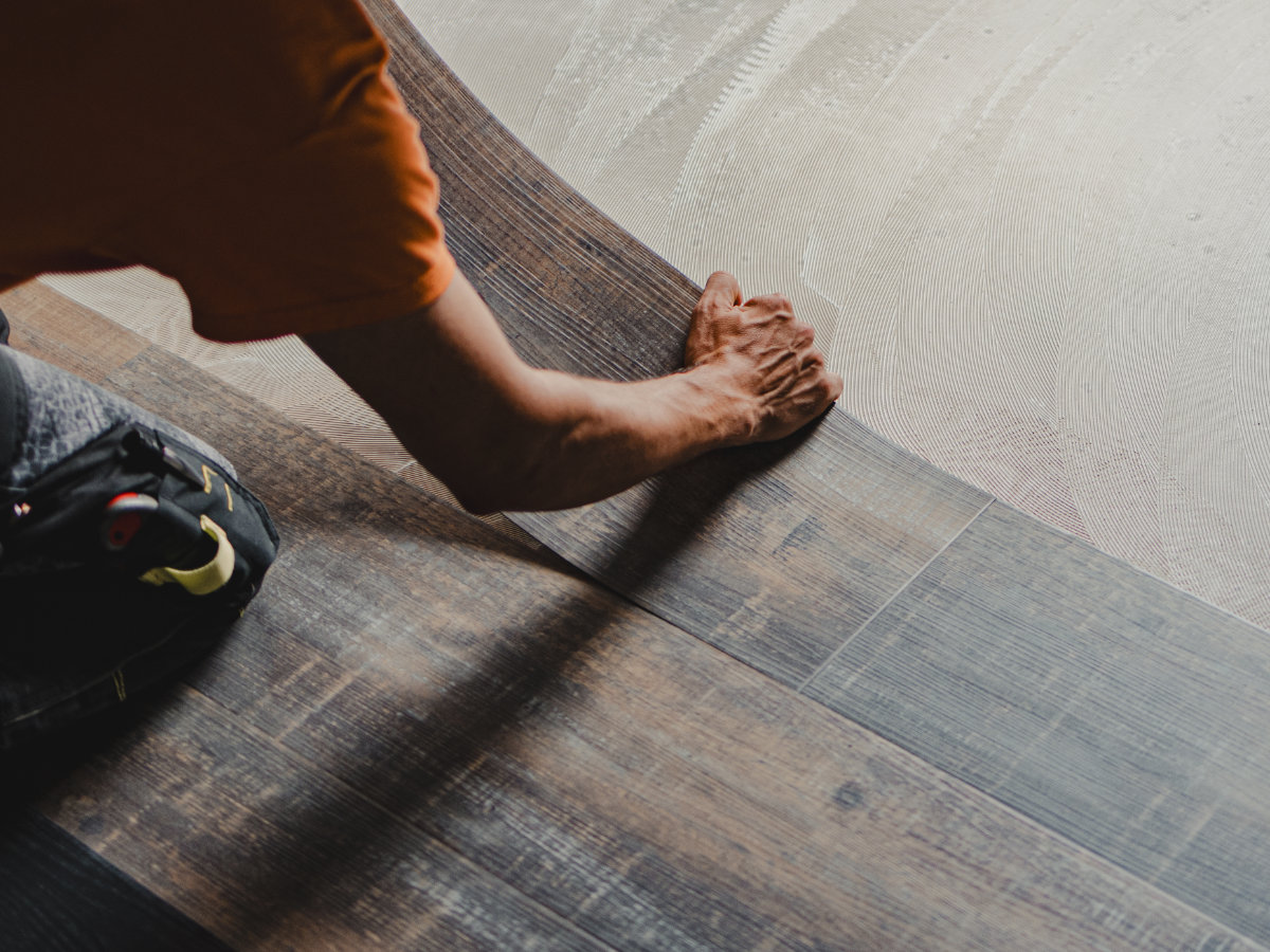 Handyman performing home repair work in a modern home interior