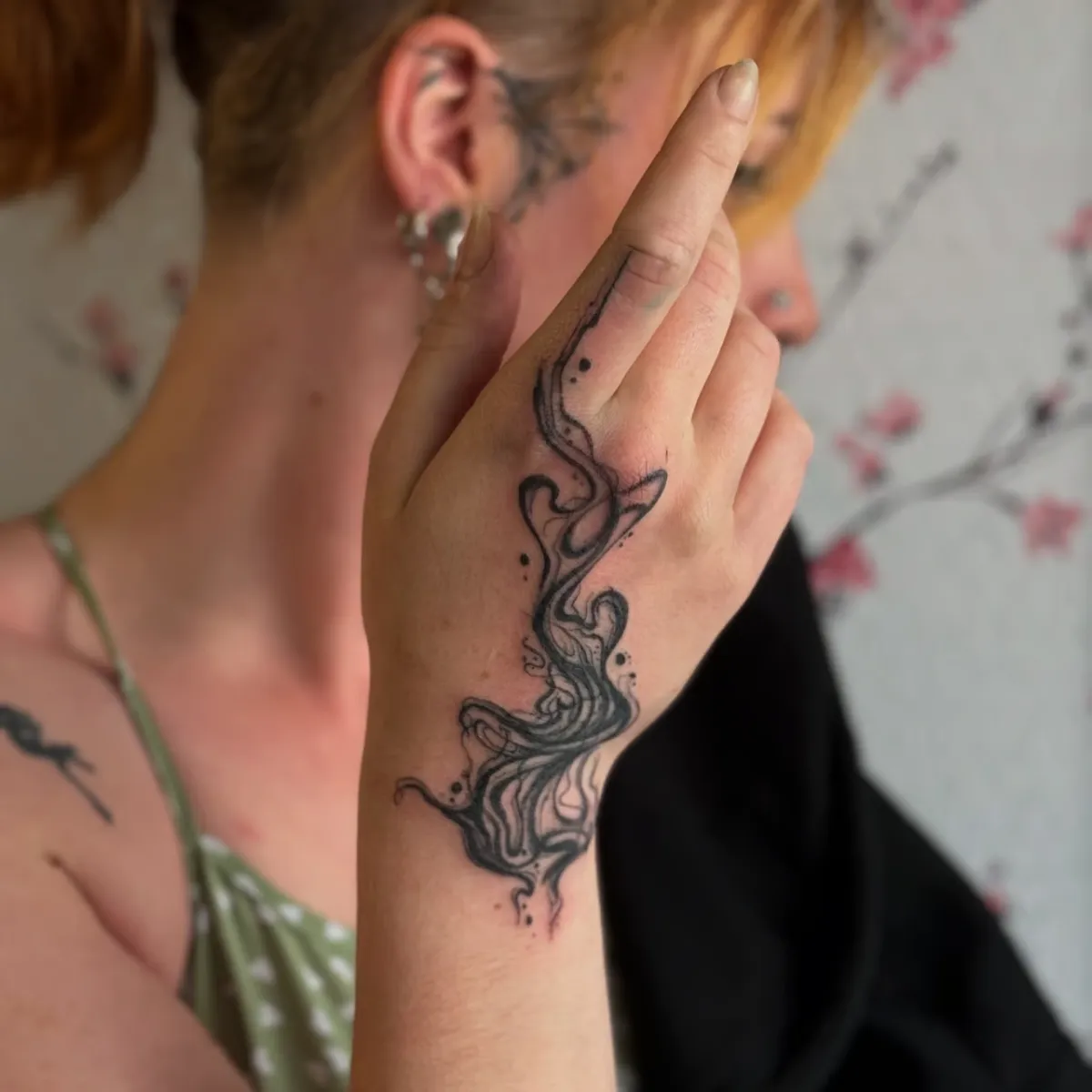 person in blue denim shorts and white nike sneakers standing on gray concrete floor