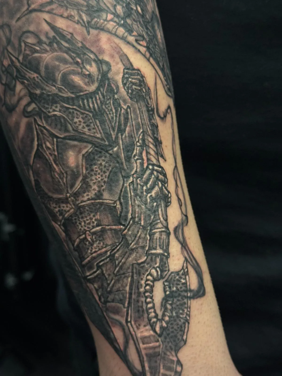 person with tattoo on right arm