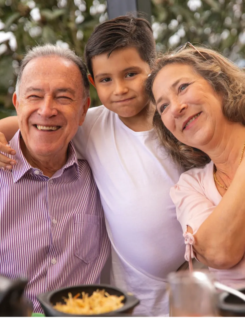 Happy multi-generational family representing Medicare peace of mind and financial security.