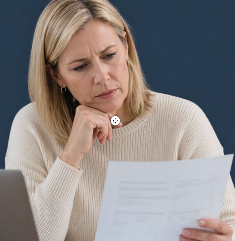 Leaseholder looking at paperwork and financial documents