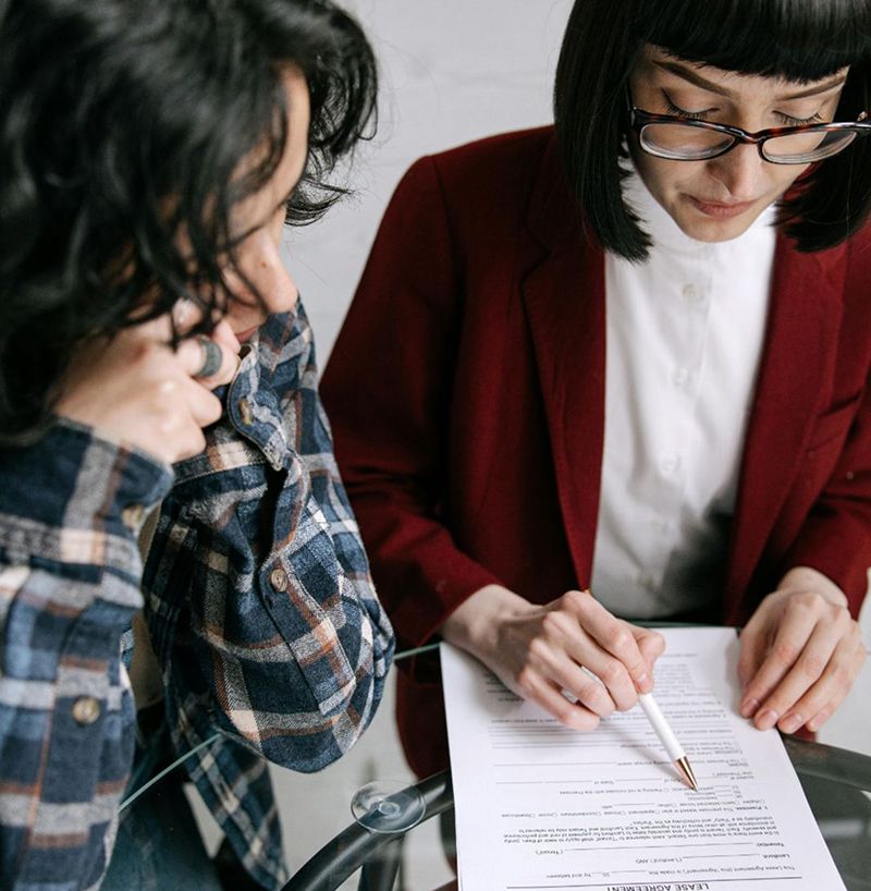 Two resdents reviewing block insurance documents