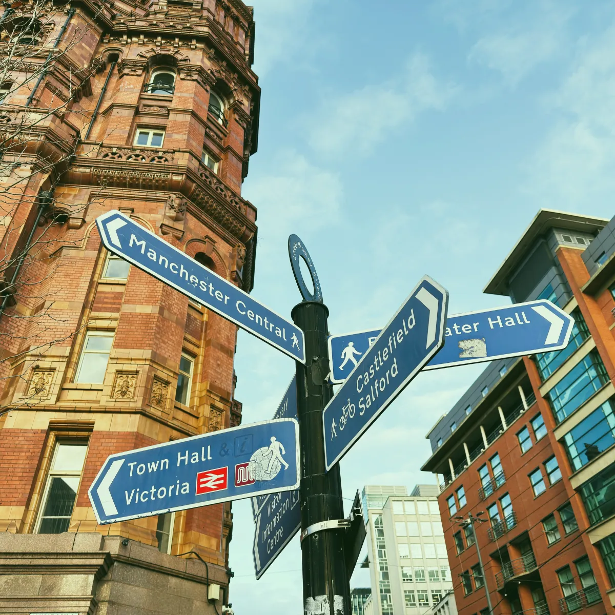 Street corner in Manchester city centre with road signs