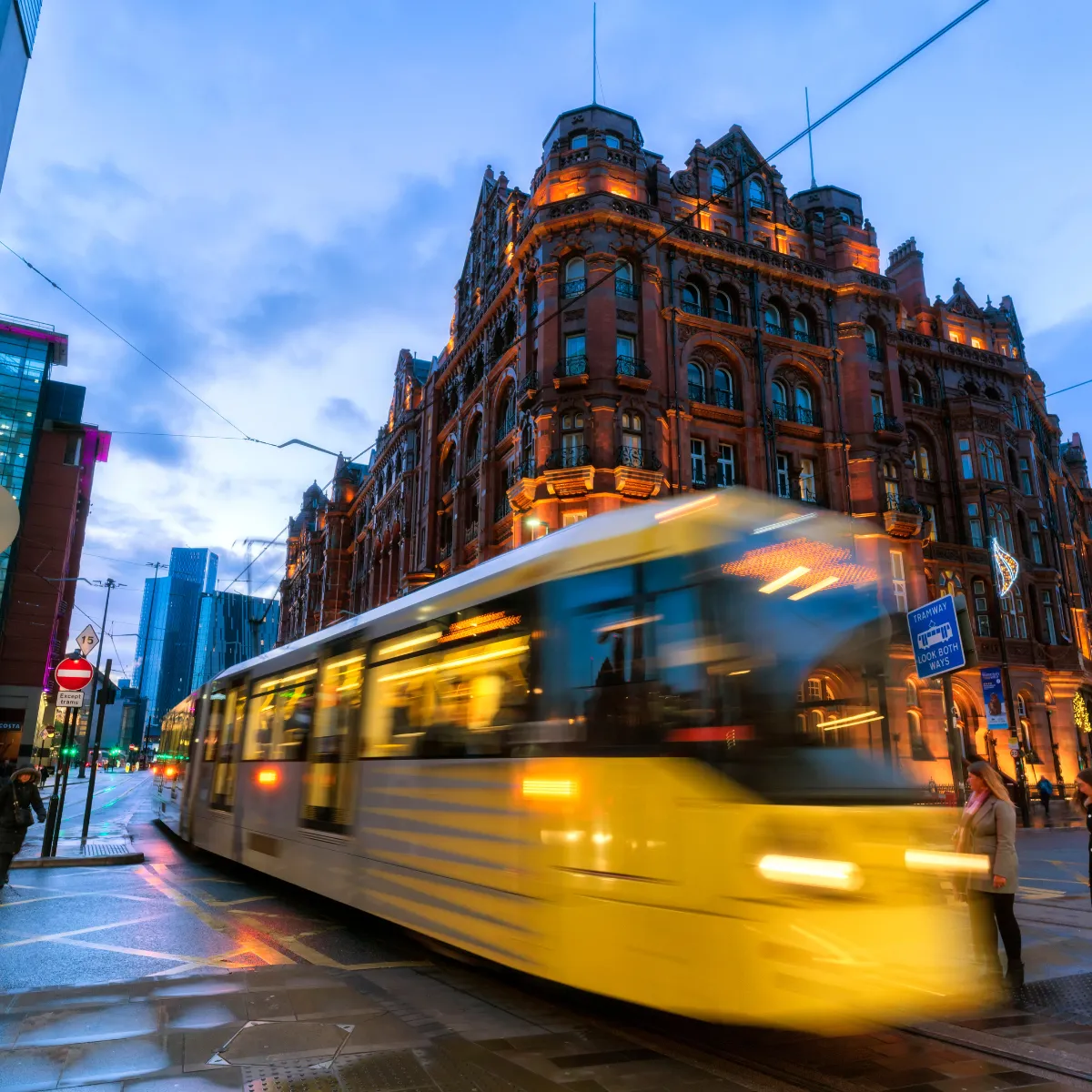 Tram travelling at speed through Manchester city centre