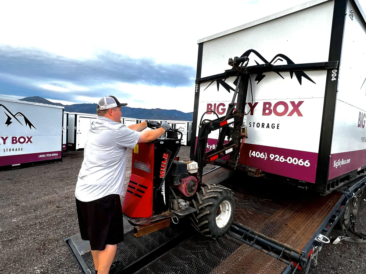 image of justin at big sky box portable storage in Frenchtown loading a container onto a truck