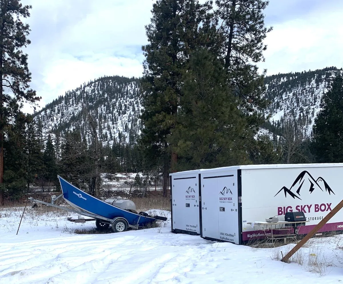 image of two portable storage containers in a snow covered lot next to a boat in Kalispell MT