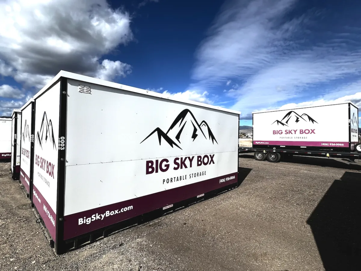 image of a 16 foot portable storage in helena container on the ground with another on a truck in the background