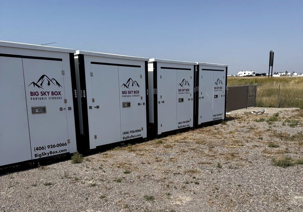 Row of Big Sky Box portable storage containers staged at our Kalispell lot on US 93 South