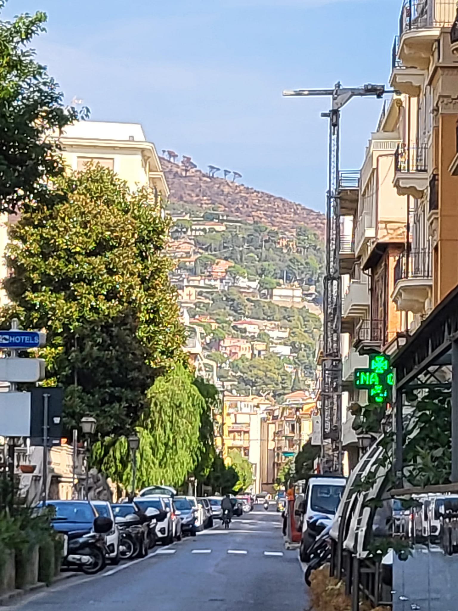 Neslyn meditating at sunrise on a quiet Balinese beach, waves gently lapping the shore. The sky is painted in soft pastels, and she sits cross-legged, eyes closed, in peaceful reflection. 1:1 aspect ratio.