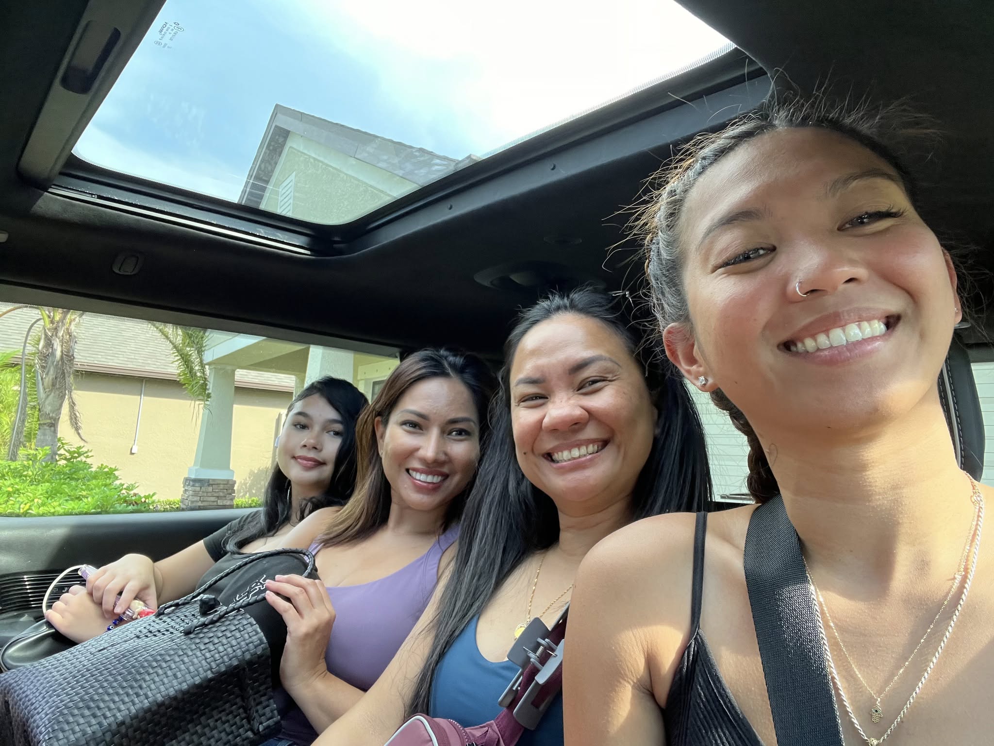 Neslyn hiking a misty mountain trail in the Swiss Alps, surrounded by wildflowers and dramatic peaks. She pauses to take in the breathtaking view, exuding a sense of accomplishment. 1:1 aspect ratio.