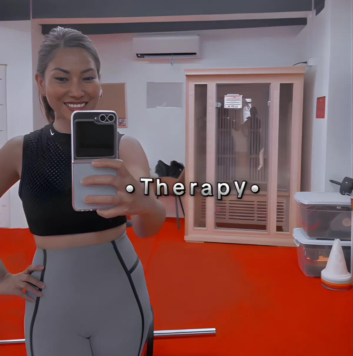 Neslyn practicing yoga on a rooftop at sunset in Santorini, white buildings and blue domes behind her. She holds a graceful pose, silhouetted against the glowing sky. 1:1 aspect ratio.