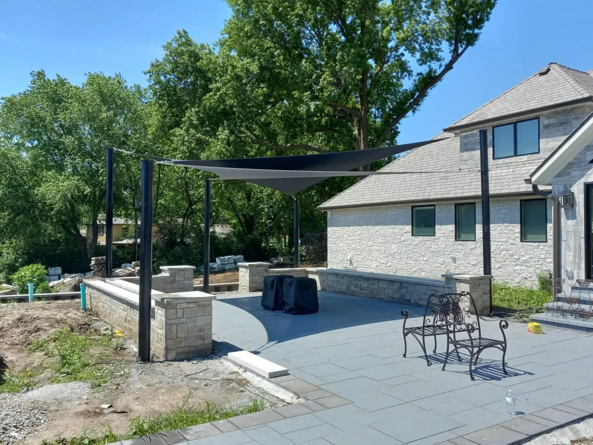 A recently installed residential backyard shade structure.