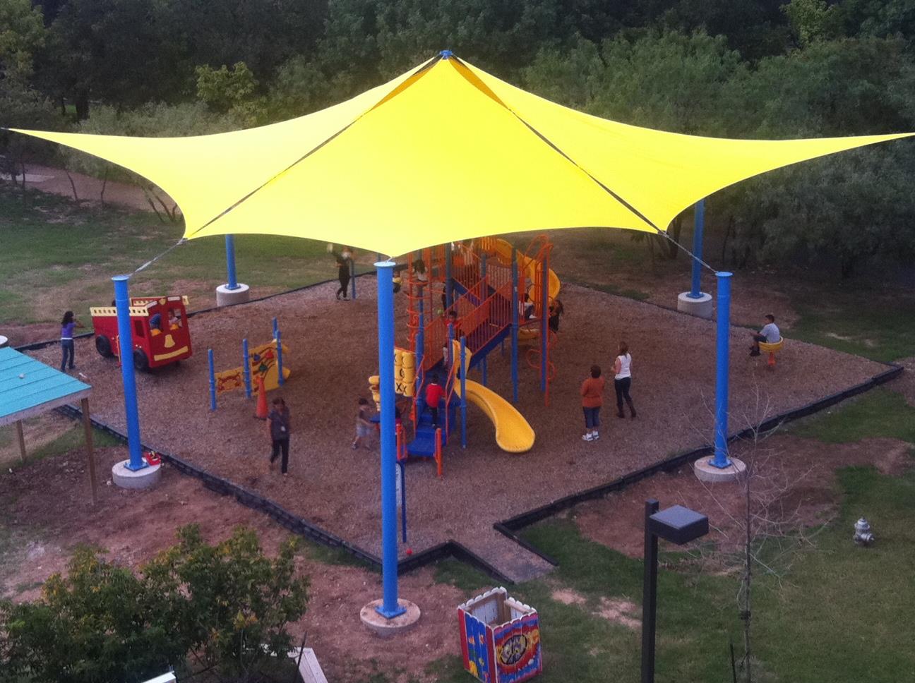 Yellow Duffer Hollow Designs playground structure at Kaboom Park