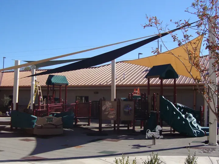 Shading provided by Duffer Hollow Designs built over daycare play structures