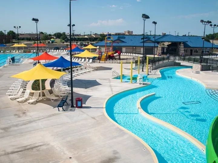 Elevated view of an aquatic center with multiple different shade structures built by Duffer Hollow Designs