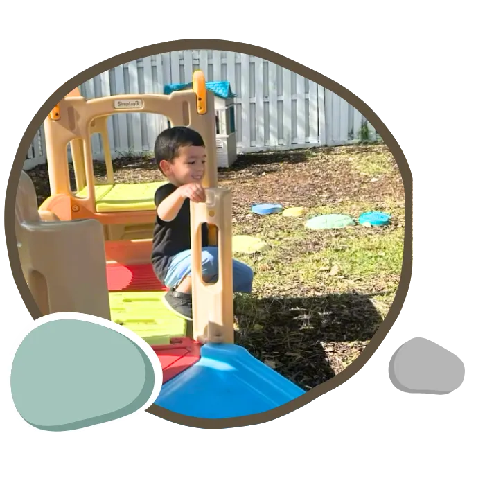 Large outdoor playground with creative installations at Pebblestone Academy in Stuart, FL