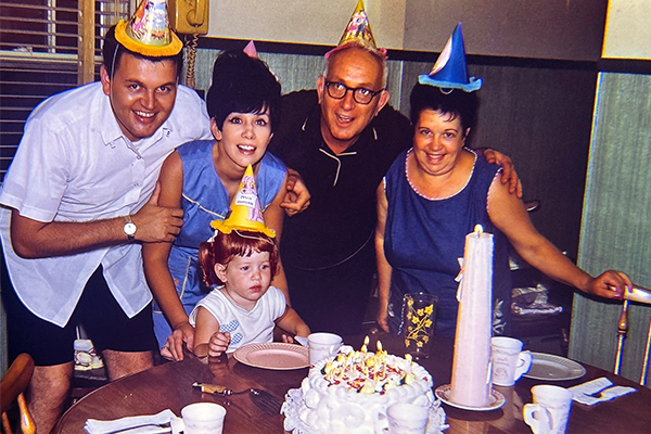 Birthday celebration around the kitchen table