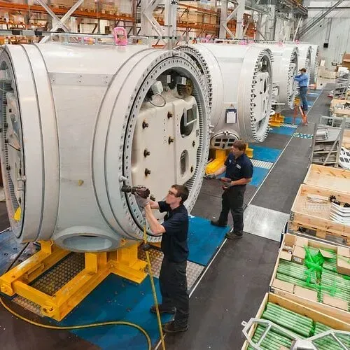 Small business owner handing keys to employees to symbolize succession