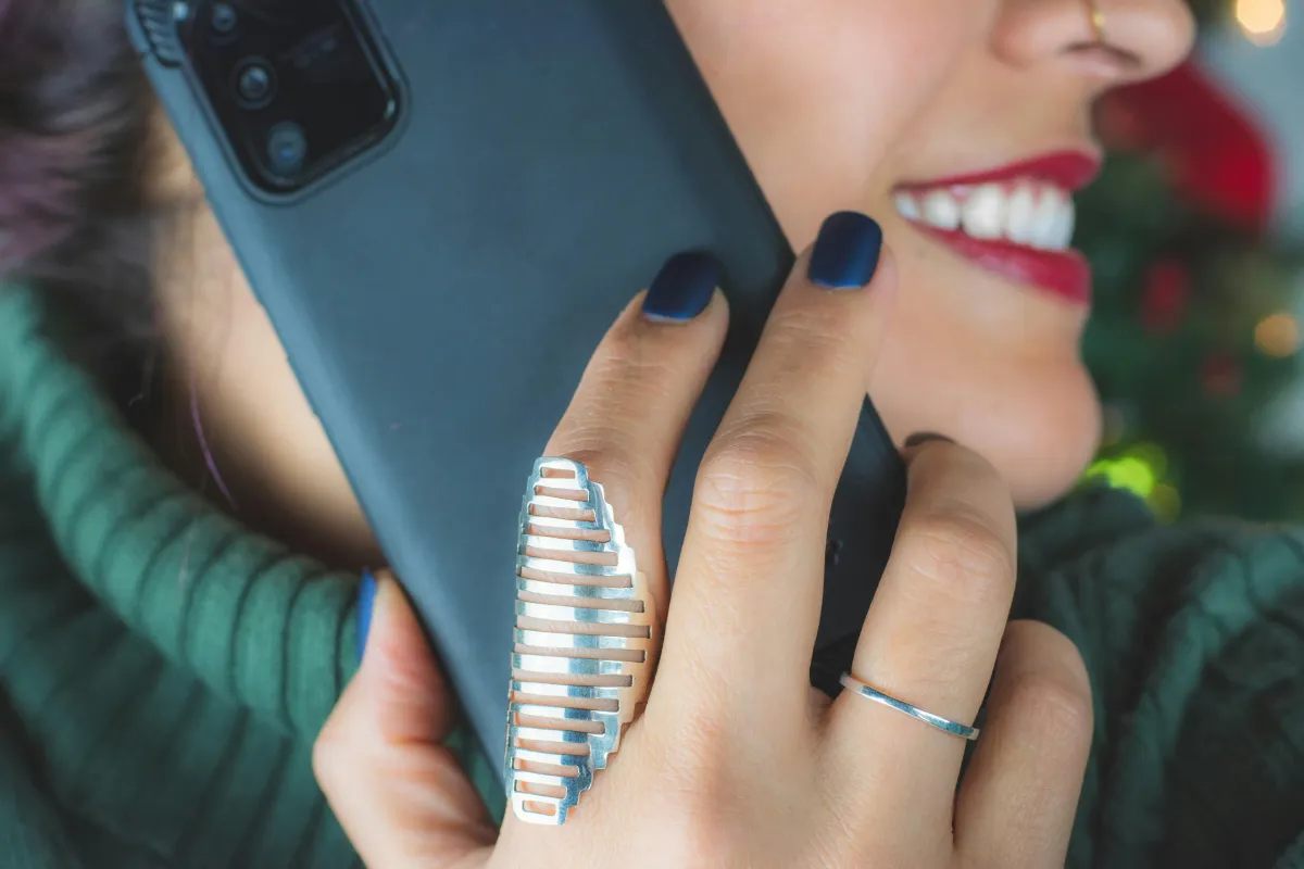 Businesswoman answering phone call to trigger automated text reply using Missed-Call Text-Back feature