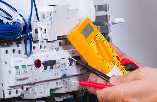Electrician repairing electric board