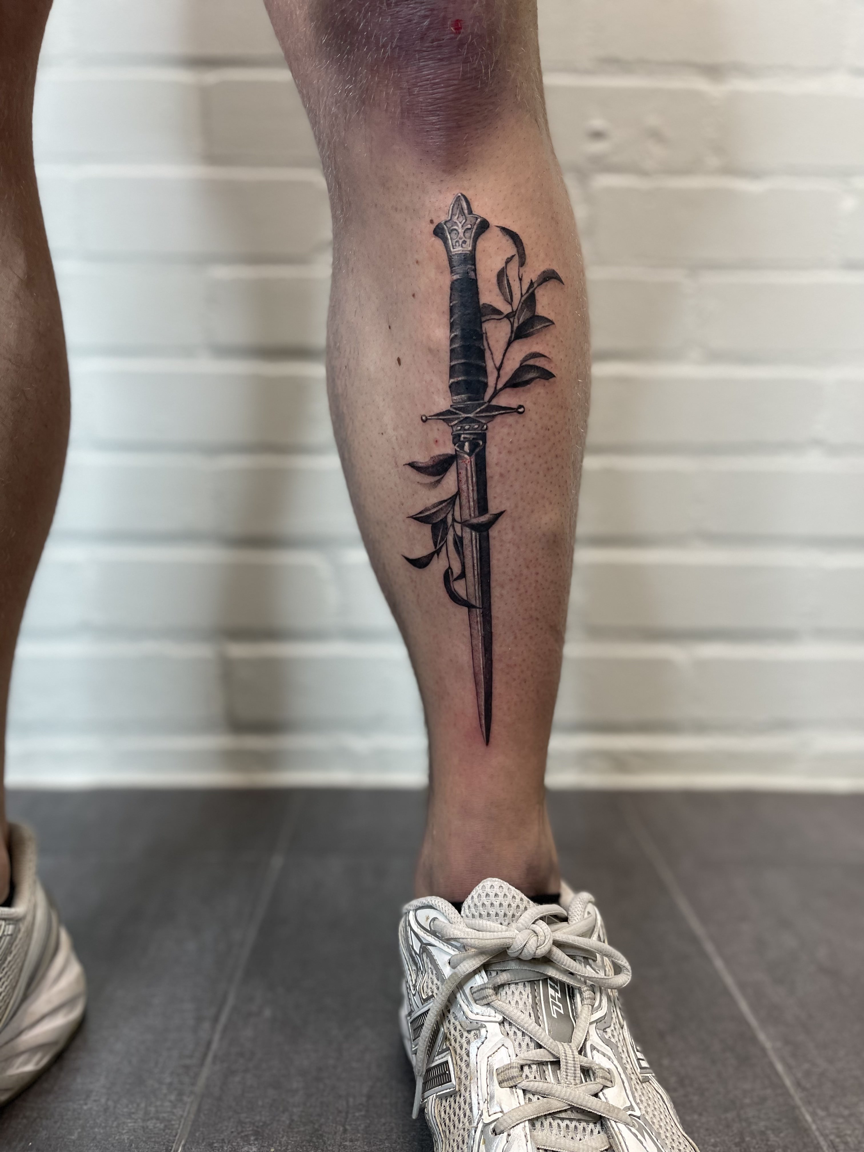 person with tattoo on right arm