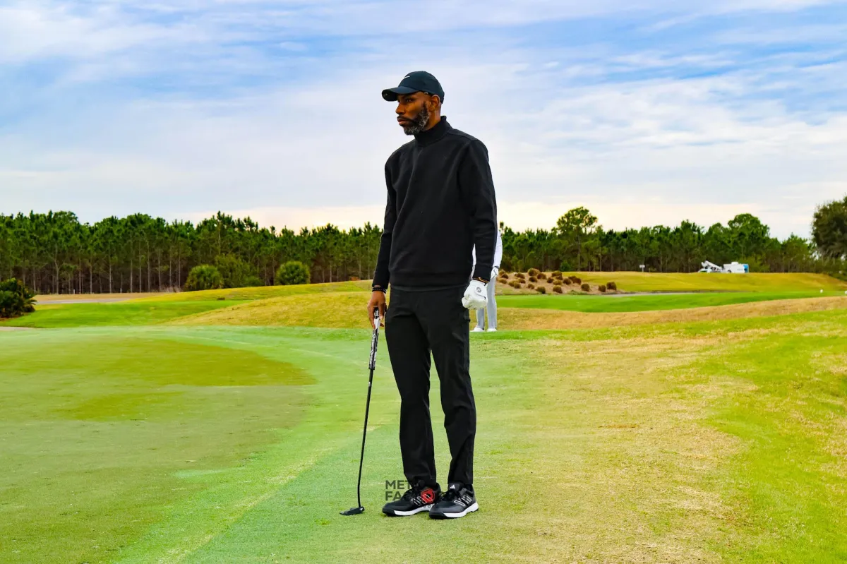 man playing golf under blue sky during daytime