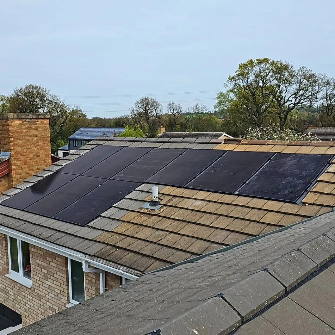 Modern UK home with solar panels, battery storage, and EV charging. A GE National smart energy system