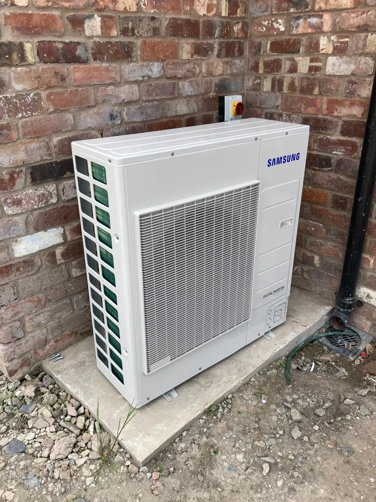 Modern UK home with solar panels, battery storage, and EV charging. A GE National smart energy system
