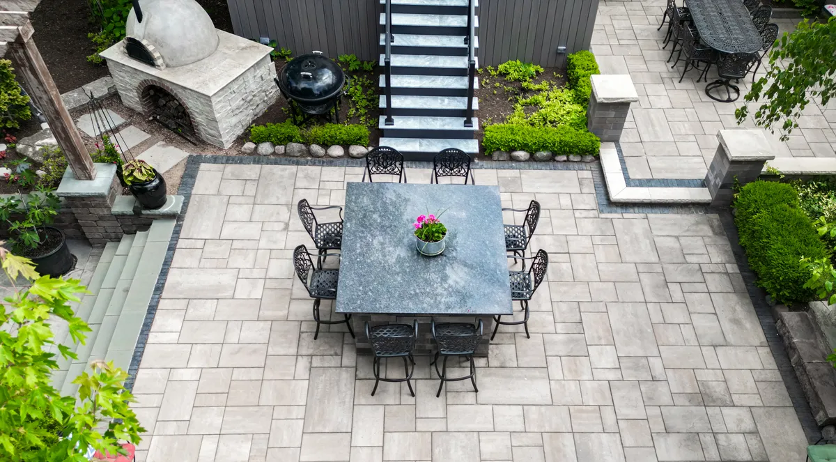 Natural stone patios and winding garden walkways