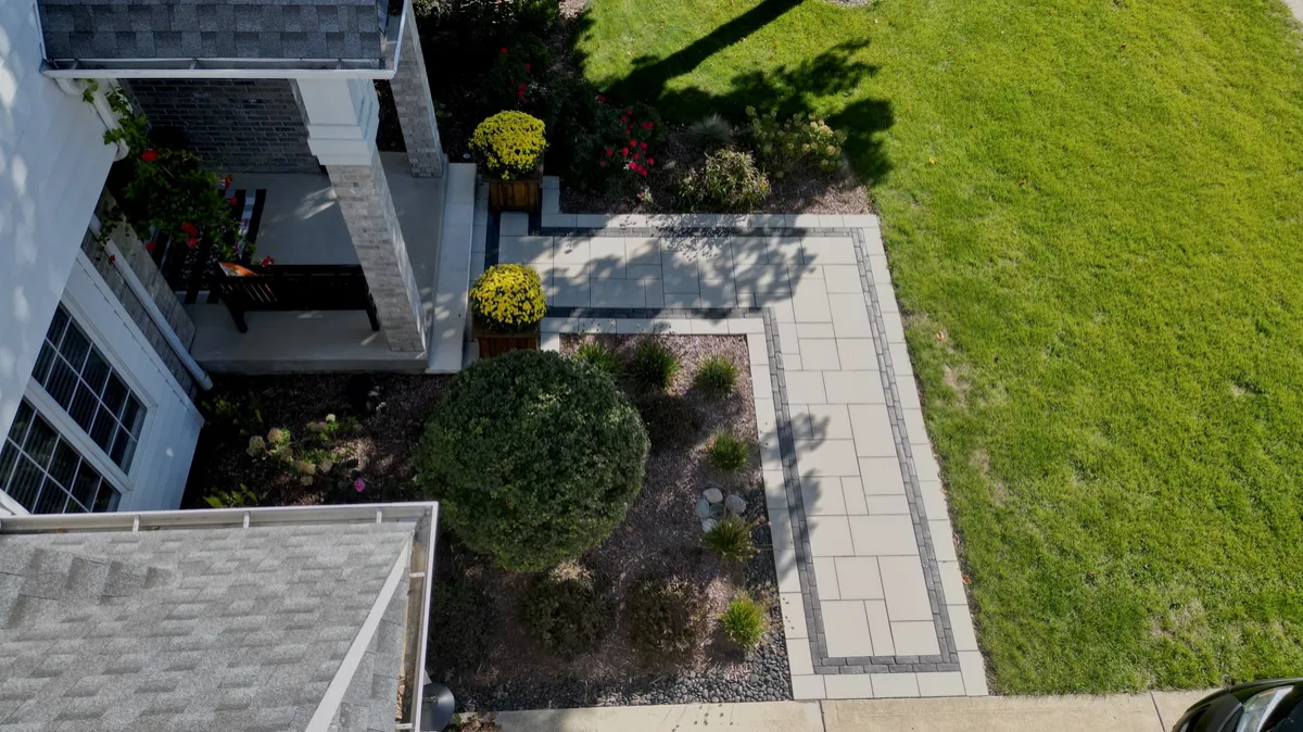 Natural stone patios and winding garden walkways