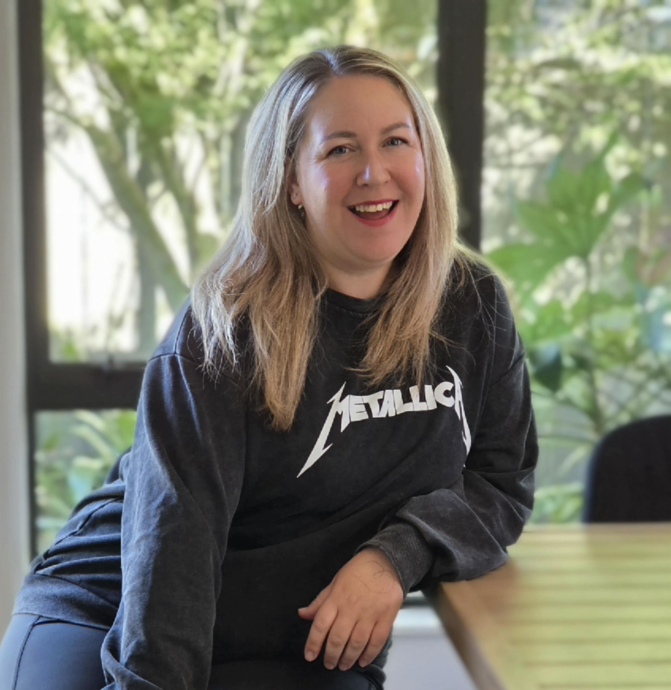 Shelley Campbell owner of Resonate Advisory and Chartered Accountant wearing a Metallica top