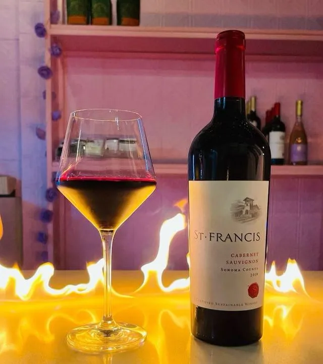 Glass and bottle of wine at Cafe Renis