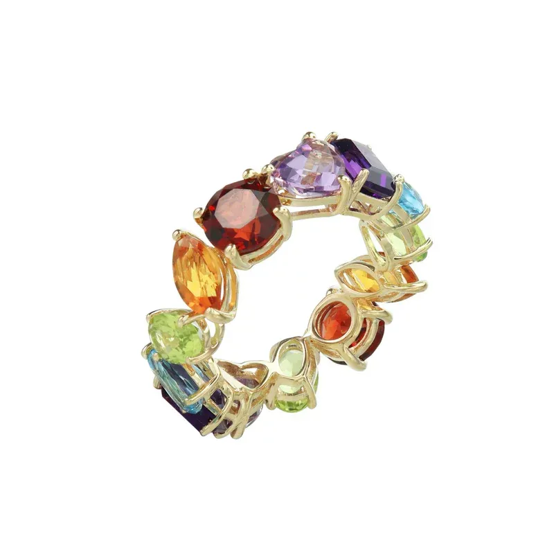 A multi-shaped half eternity ring designed with colorful gemstones in various shapes set in a 14k yellow gold band