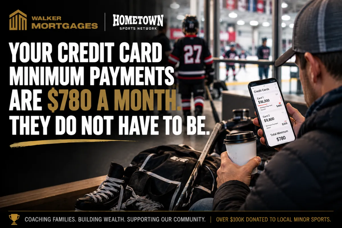 A parent checking a banking app on their phone in a rink lobby while a hockey bag sits on a bench nearby