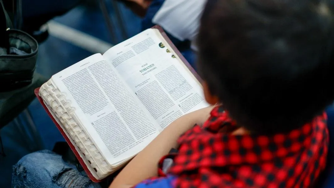 Arise New Day Christian Academy student reading bible