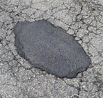 asphalt pot hole filling