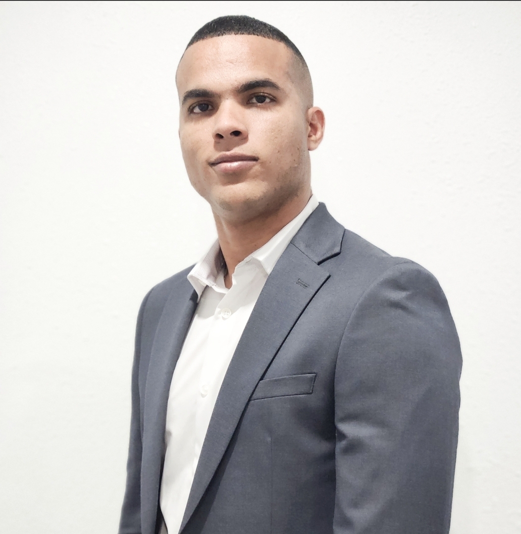 man wearing watch with black suit