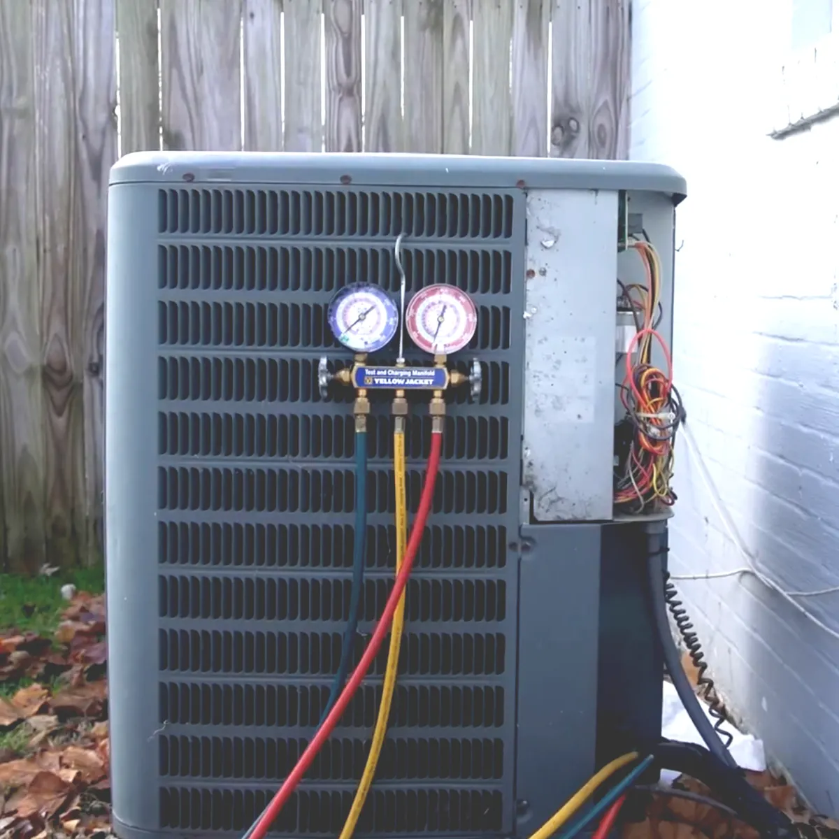HVAC technician evaluating system components