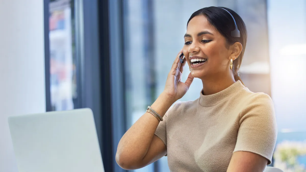 person's hand on MacBook near iPhone flat lay photography