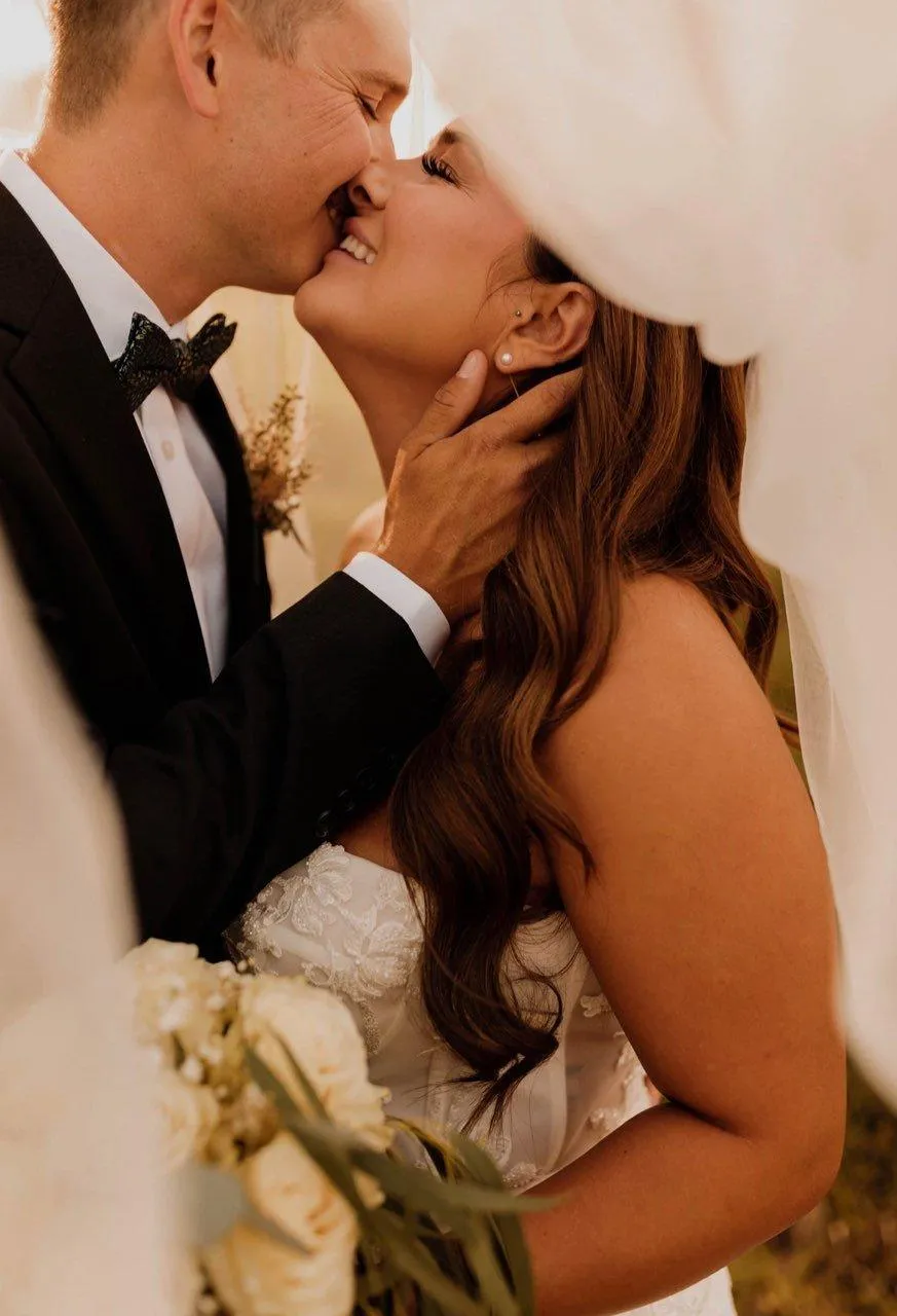 bride and groom kissing