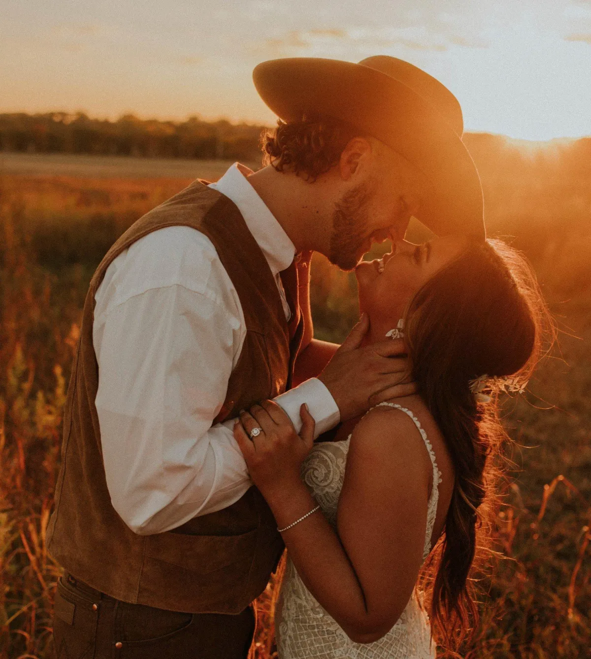 bride kissing in the sun