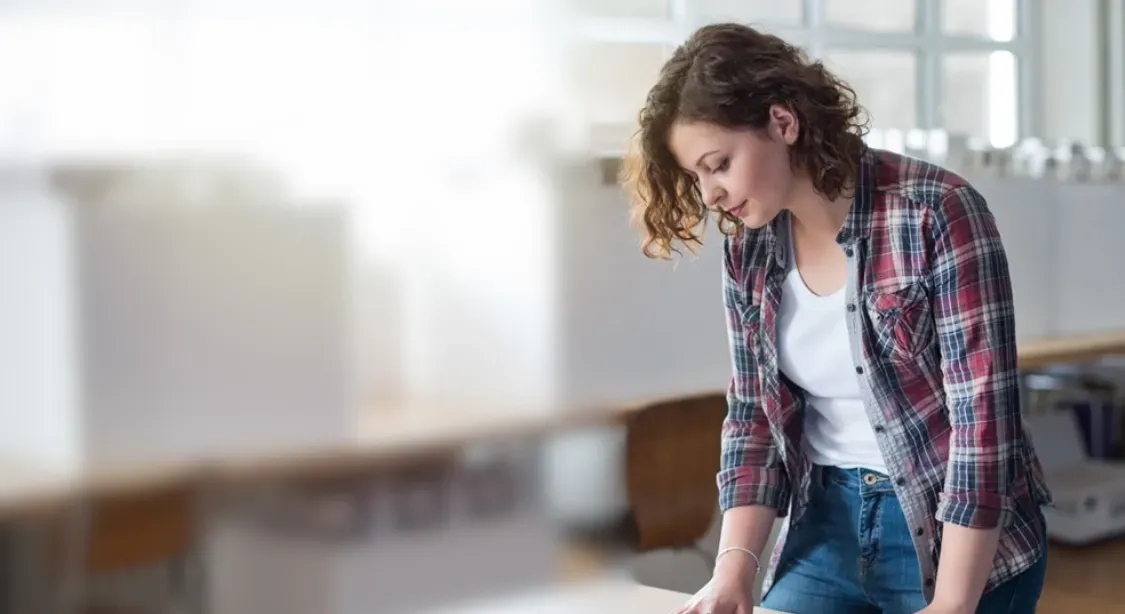 Professional bookkeeper reviewing documents with a smile