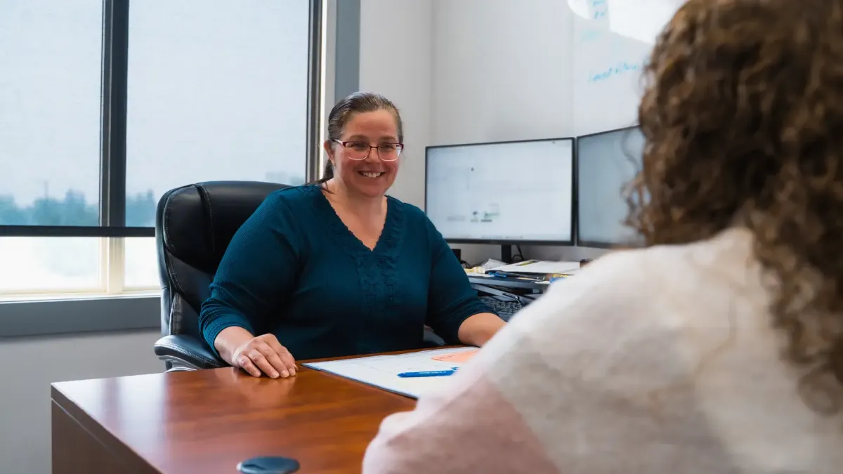 Bookkeeping professional meeting with a client in Grande Prairie