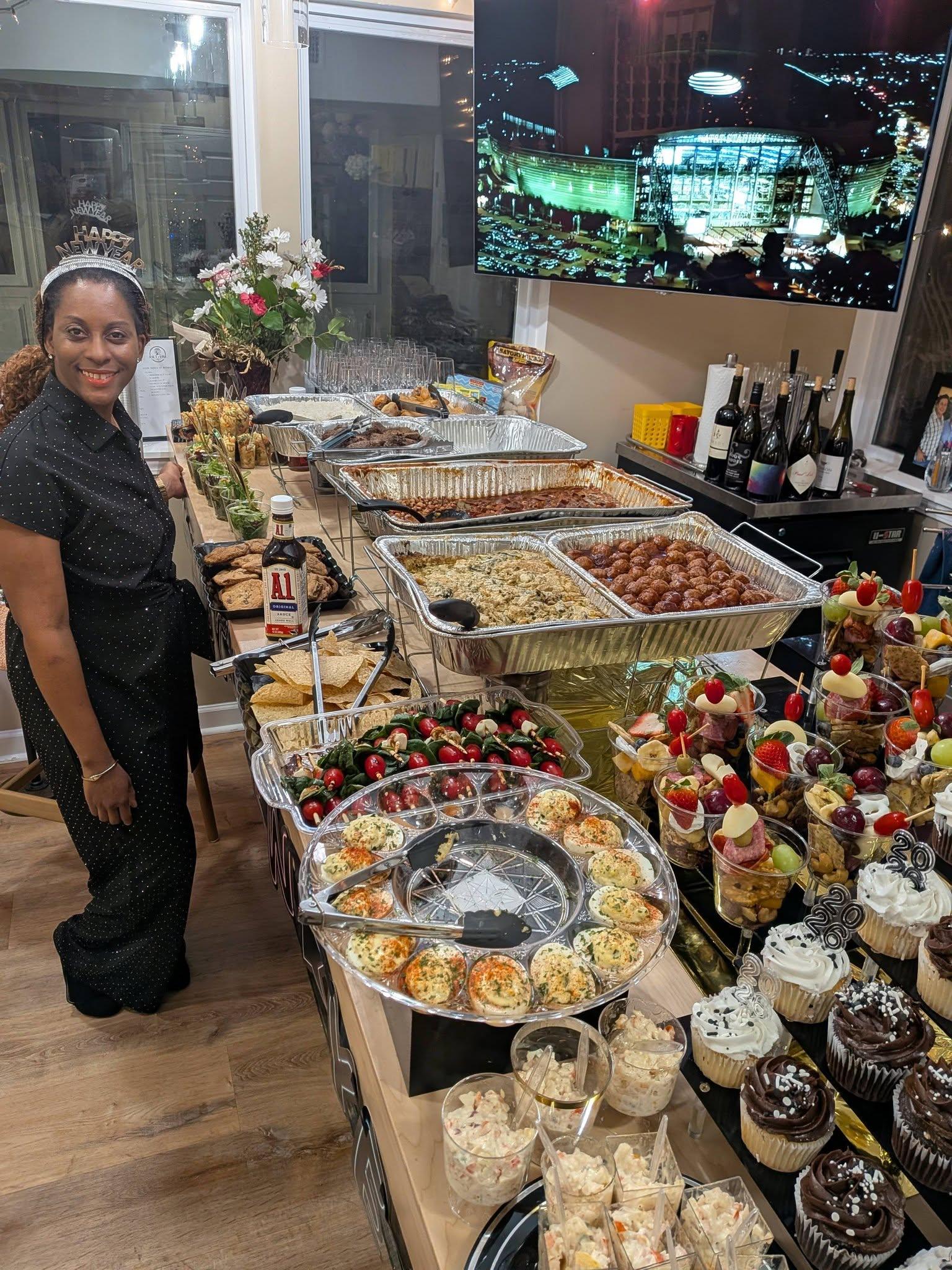 Caribbean and seafood catering spread featuring jerk chicken, shrimp, oysters, and tropical fruits from Castle Gardens ILM Wilmington