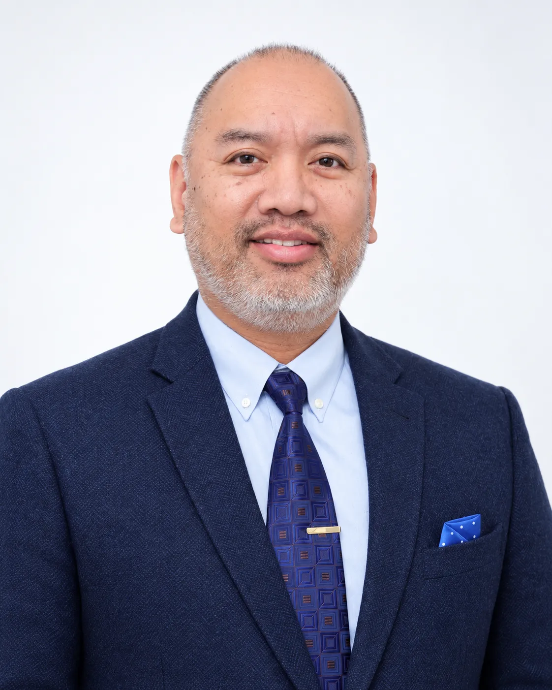 Jonathan Pinuela engaged in an authentic client consultation call in a warm, professional office setting.