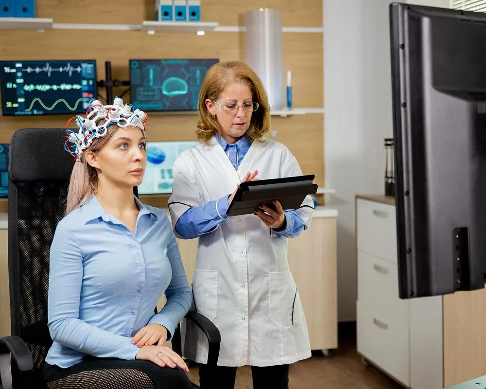 woman sitting on grass field during day