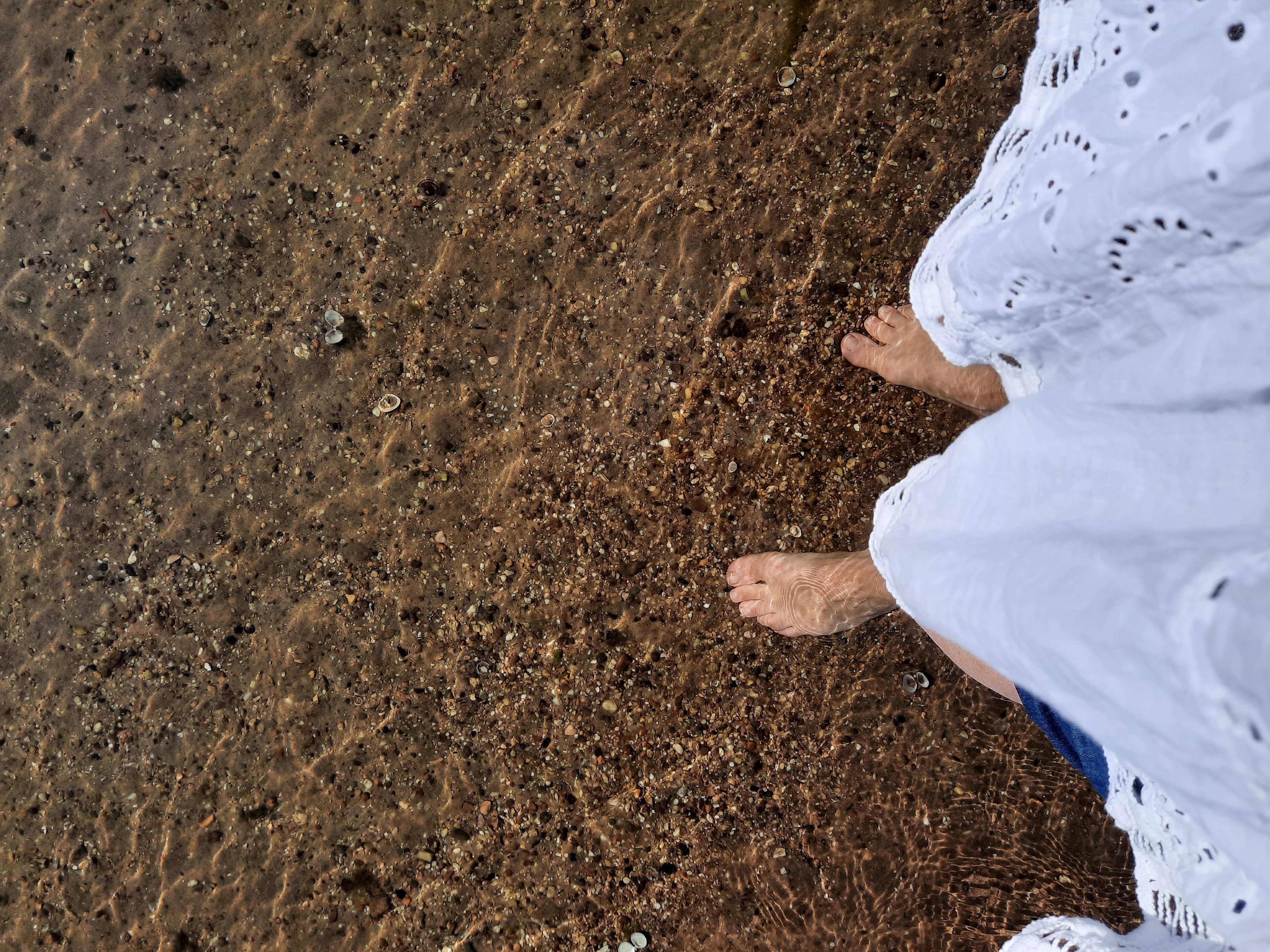 low-angle photography of man in the middle of buidligns